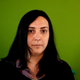 Clara "Keffals" Sorrenti stands in front of a green screen.